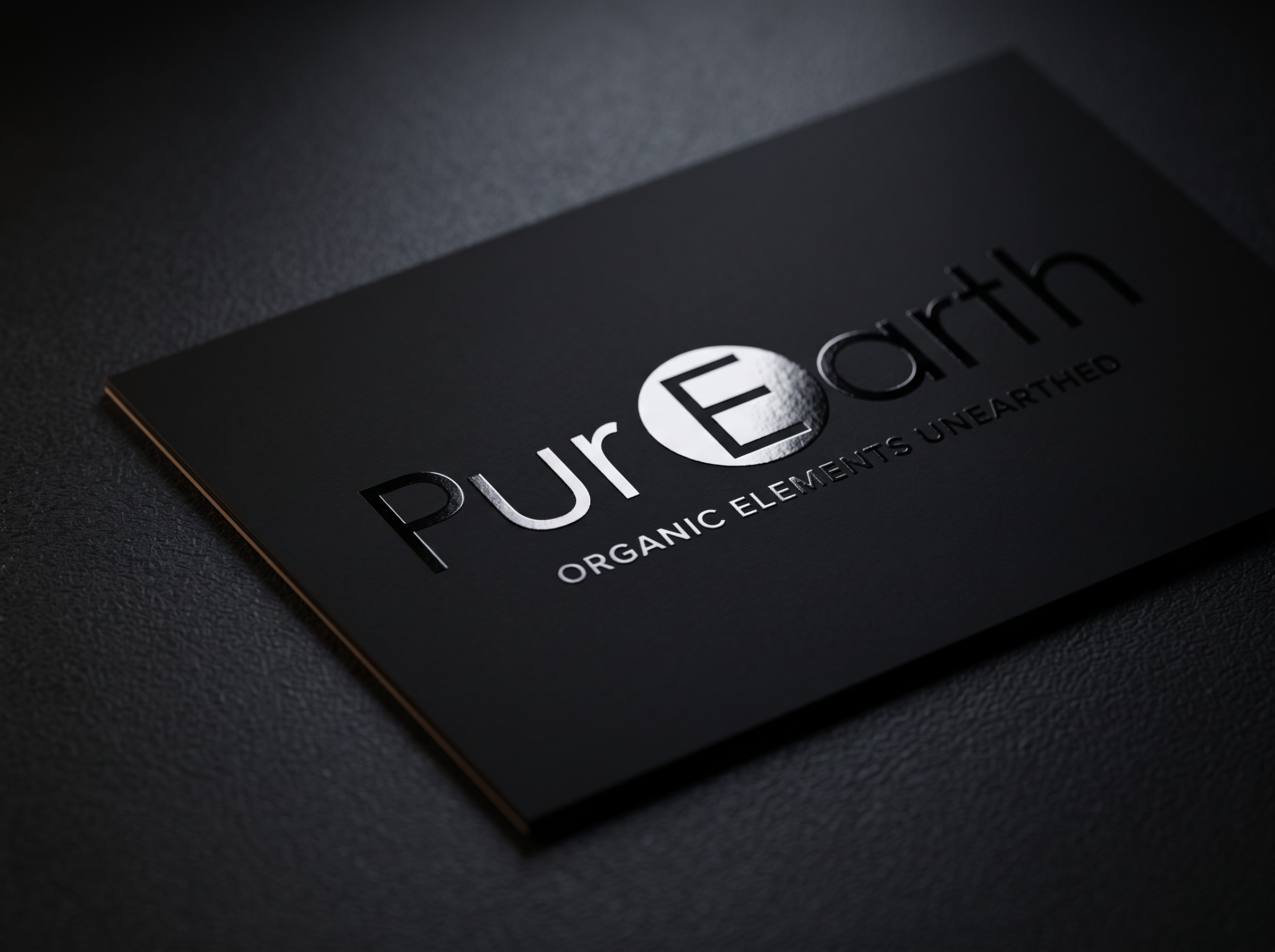 Matte black business card with raised spot UV gloss logo